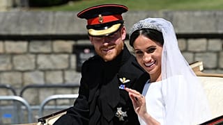 Prince Harry and Meghan wave from their carriage after their wedding at Windsor Castle on 19 May 2018. (Paul Ellis/Pool Photo via AP)