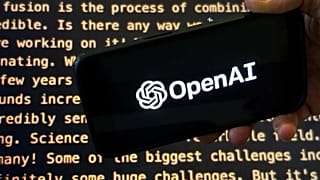 FILE - The OpenAI logo appears on a mobile phone in front of a screen showing part of the company website in this photo taken on Nov. 21, 2023 in New York. 