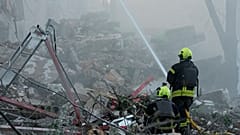 Emergency services personnel work to extinguish a fire after a Russian strike on Kyiv, 2 July, 2026