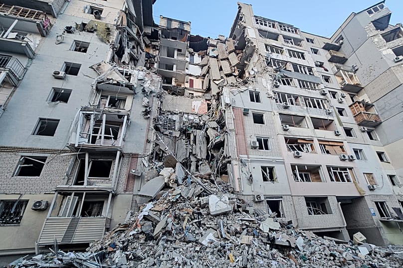 A building is seen heavily damaged by a Russian strike in Kherson, 20 February, 2025
