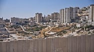The separation wall next to the Arab neighbourhood of Al-Eizariya near where the Israeli government says E1 housing units will be built, 21 August, 2025