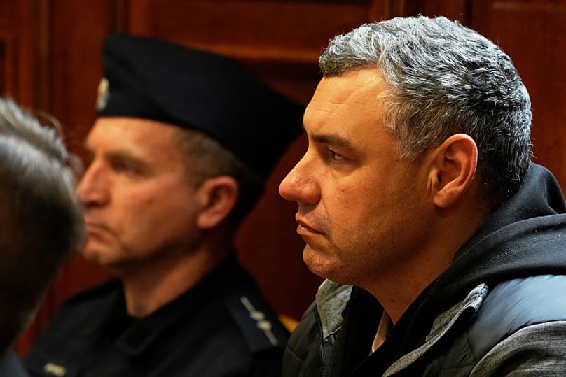 Ukrainian defendant Volodymyr Zhuravlov listens as a judge announces the decision not to allow for extradition to Germany in Warsaw, 17 October, 2025