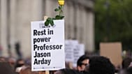 A sign is held during a vigil by Stand Up to Racism in memory of late University of Cambridge professor Jason Arday in London, 17 August, 2026