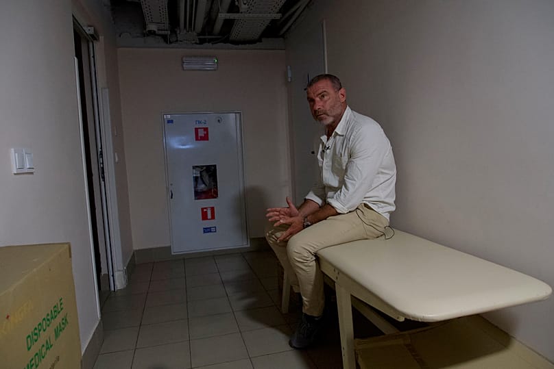 Actor Liev Schreiber sits in one of Solomianskyi district hospital's bomb shelter during an air alert during his trip for Ukraine's Independence day as UNITED24 ambassador.
