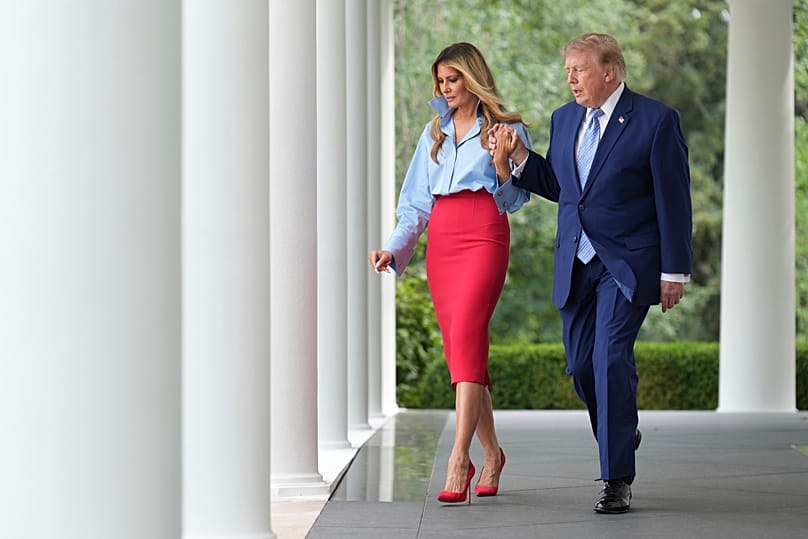 US President Donald Trump and first lady Melania Trump walk to an event in the Rose Garden of the White House, 20 August, 2026