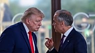 President Donald Trump speaks with Canadian Prime Minister Mark Carney, right, at a working lunch with leaders of G7 and the Middle East in Evian-les-Bains, France.