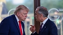 President Donald Trump speaks with Canadian Prime Minister Mark Carney, right, at a working lunch with leaders of G7 and the Middle East in Evian-les-Bains, France.