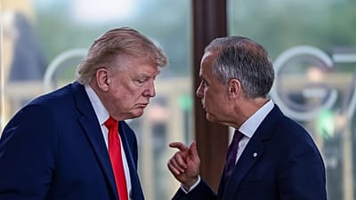 President Donald Trump speaks with Canadian Prime Minister Mark Carney, right, at a working lunch with leaders of G7 and the Middle East in Evian-les-Bains, France.