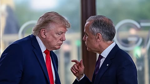 President Donald Trump speaks with Canadian Prime Minister Mark Carney, right, at a working lunch with leaders of G7 and the Middle East in Evian-les-Bains, France.