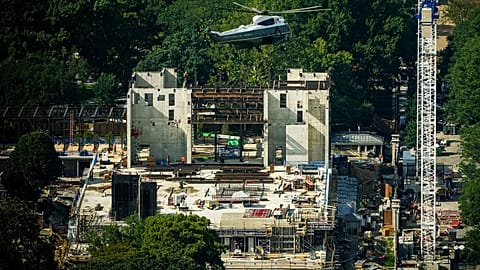  Marine One with President Donald Trump passes over construction on the new White House ballroom, Friday, Aug. 21, 2026,