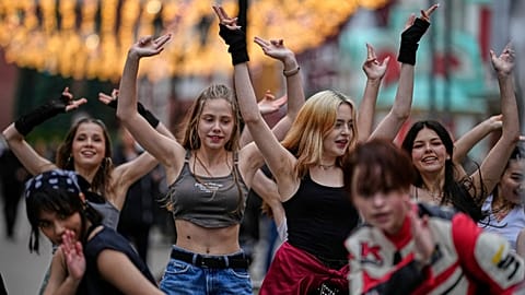 FILE: A group of teenagers rehearse a K-pop dance routine in Moscow, Russia, on Tuesday 1 July 2025.