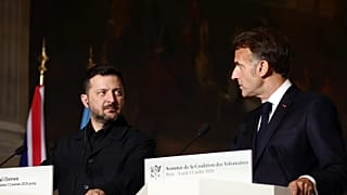 Ukrainian President Volodymyr Zelensky, left, and French President Emmanuel Macron address a press conference after a Coalition of the Willing summit.