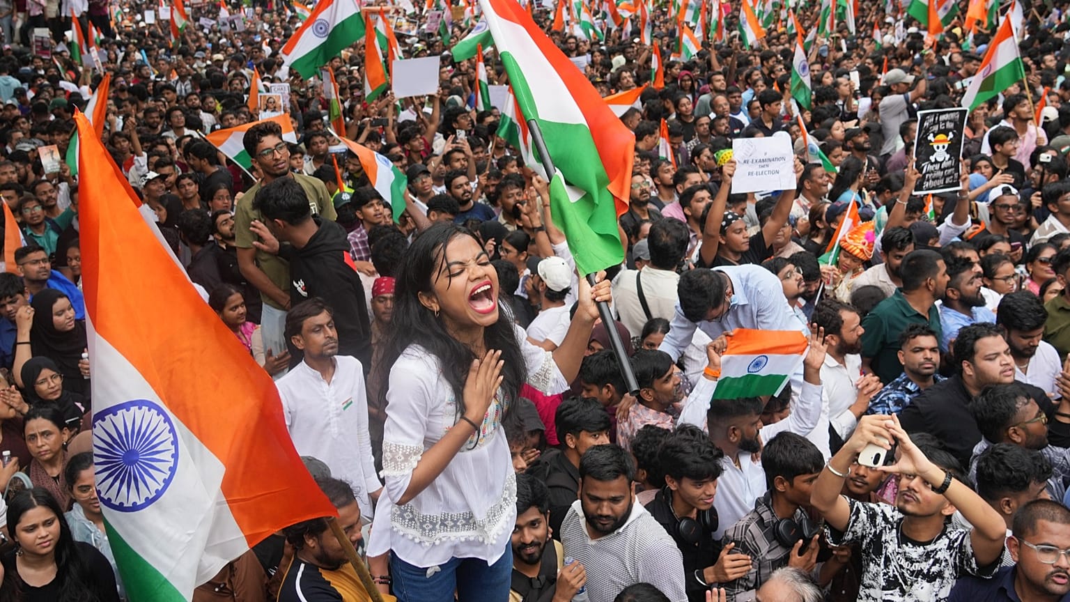 Protesters celebrate after Education Minister Dharmendra Pradhan resigned in Mumbai, 26 July, 2026