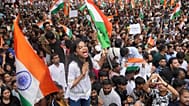 Protesters celebrate after Education Minister Dharmendra Pradhan resigned in Mumbai, 26 July, 2026