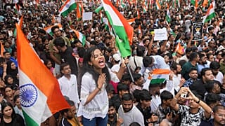 Protesters celebrate after Education Minister Dharmendra Pradhan resigned in Mumbai, 26 July, 2026