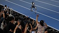 Spectators cheer a robot competing in the 1500m during the World Humanoid Robot Games in Beijing, Sunday, Aug. 23, 2026. 