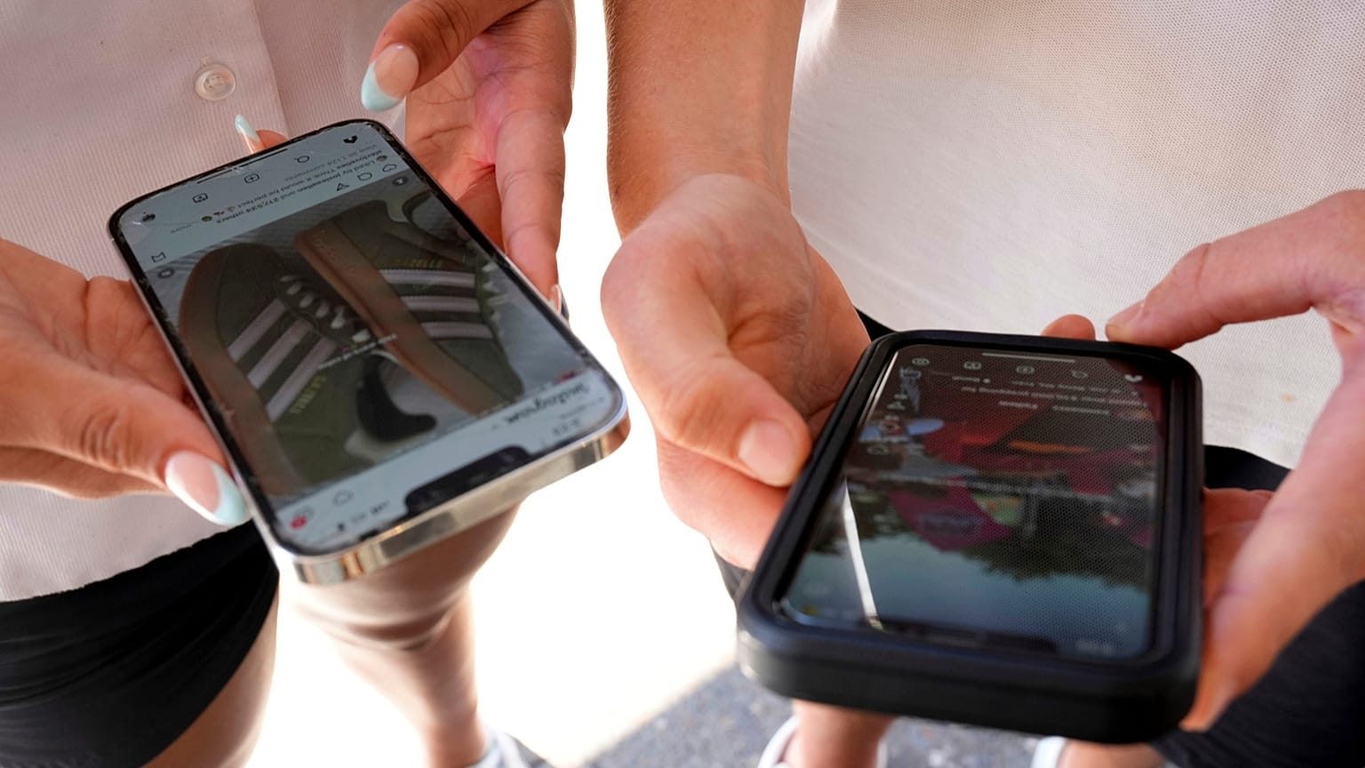 Young people use their phones to view social media in Sydney, 8 November, 2024