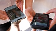 Young people use their phones to view social media in Sydney, 8 November, 2024