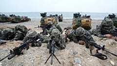 South Korean Marines take positions after landing on the beach during joint military amphibious drills with the US in Pohang, 2 September, 2024