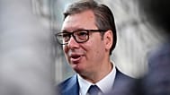 Serbian President Aleksandar Vucic speaks with the media as he arrives for an EU summit in Brussels, Thursday, June 23, 2022.
