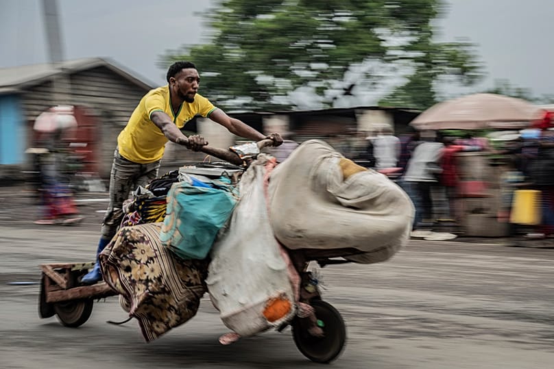 A person displaced by the fighting with M23 rebels evacuates with their belongings to downtown Goma, Democratic Republic of the Congo, Jan. 26, 2025. 