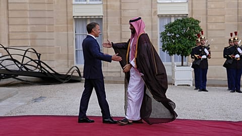 FILE: France's President Emmanuel Macron greets Saudi Crown Prince Mohammed bin Salman before a meeting at the Elysee Palace in Paris, 24 August 2025