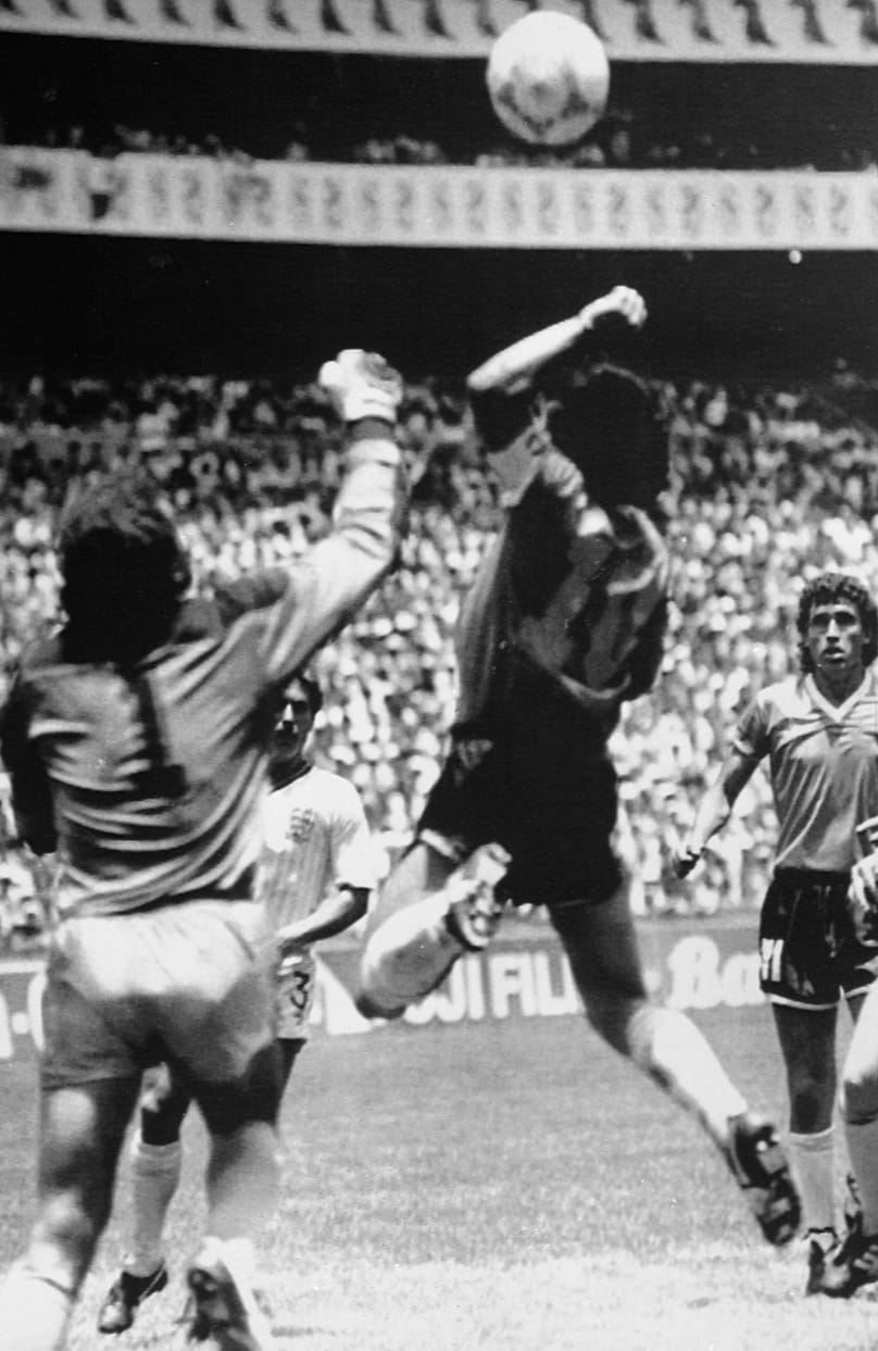 Diego Maradona about to score the controversial first goal against England, on 23 June 1986, in Mexico City.