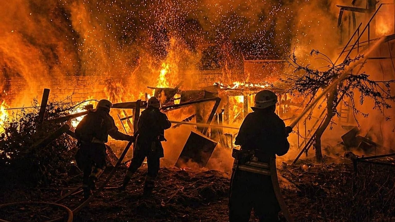 Rescue workers put out a fire of a residential building destroyed by a Russian drone strike on Odesa region, 29 April, 2026