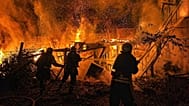 Rescue workers put out a fire of a residential building destroyed by a Russian drone strike on Odesa region, 29 April, 2026