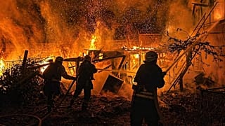 Rescue workers put out a fire of a residential building destroyed by a Russian drone strike on Odesa region, 29 April, 2026
