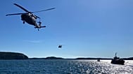Swedish Black Hawk helicopters fly past a Navy ship in the southern Stockholm archipelago, 19 April, 2023