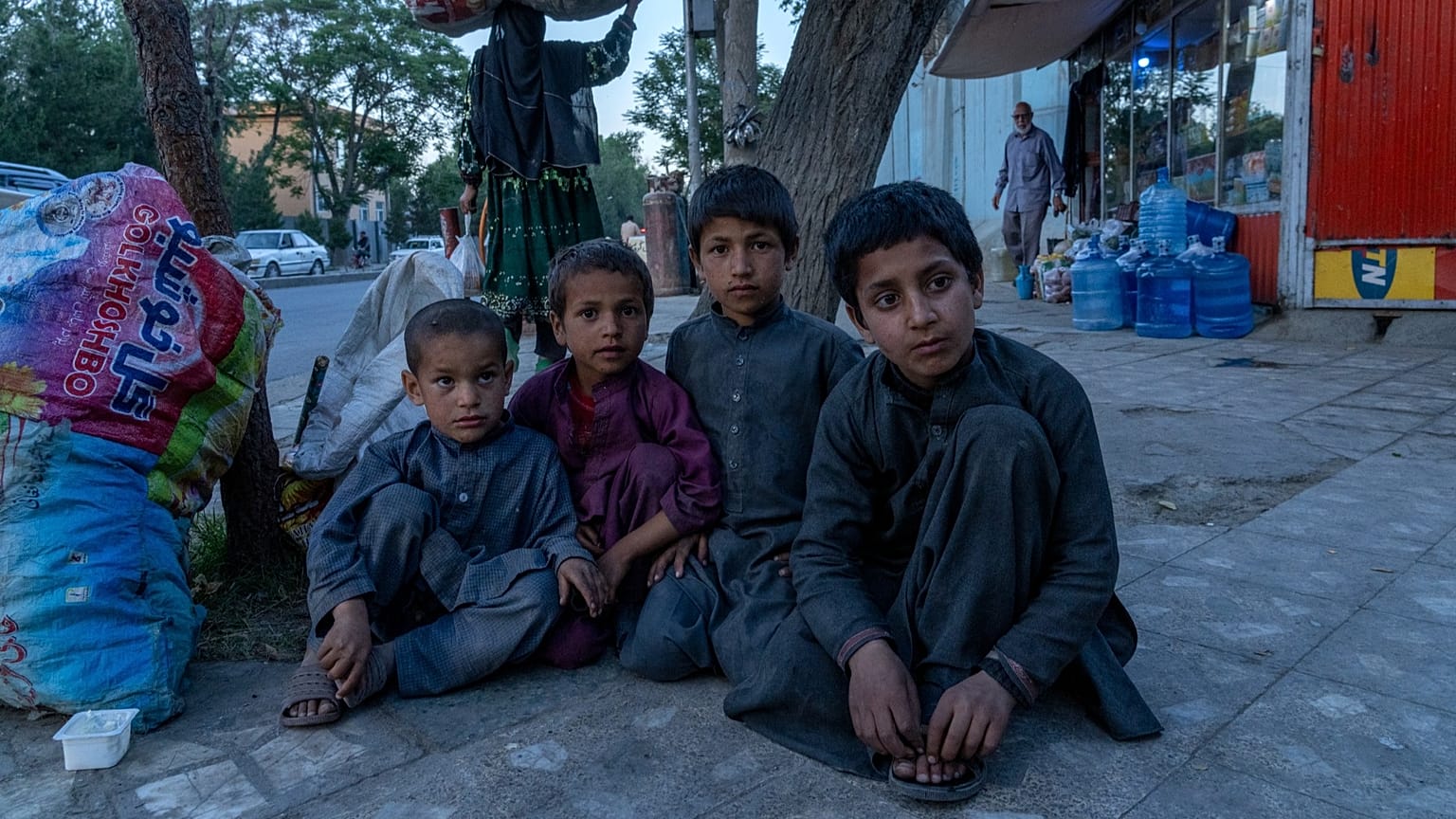 Afghan children beg on a street in Kabul, 24 May, 2022