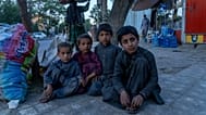 Afghan children beg on a street in Kabul, 24 May, 2022
