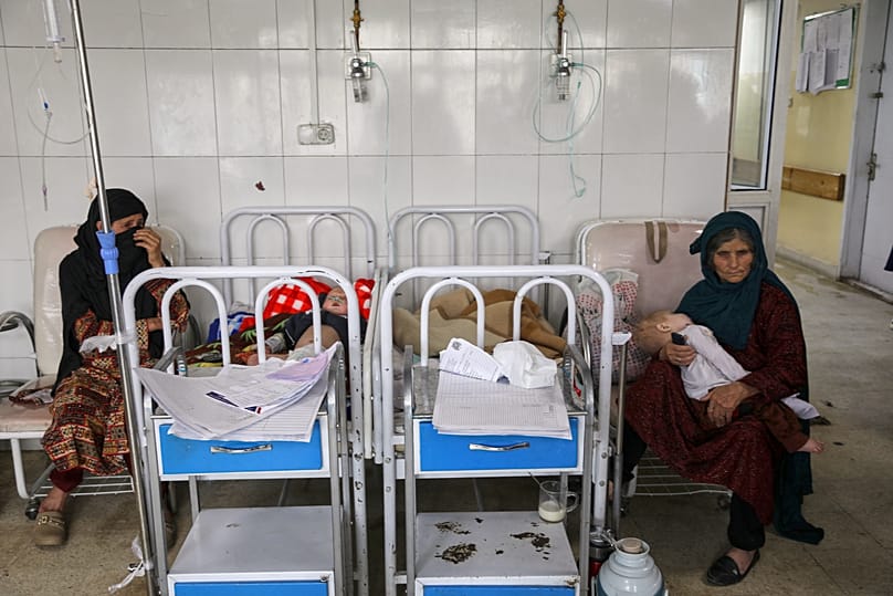 Afghan women care for their children in the malnutrition ward at Indira Gandhi Children's Hospital in Kabul, 15 February, 2026