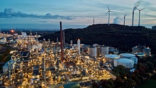 File - Wind turbines turn beside BP’s Scholven refinery in Gelsenkirchen, Germany, on 22 October 2022. 