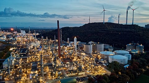 File - Wind turbines turn beside BP’s Scholven refinery in Gelsenkirchen, Germany, on 22 October 2022. 