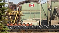 Rolled coils of steel sit in the yard at the ArcelorMittal Dofasco steel plant in Hamilton, Ont. on Thursday, Aug. 20, 2026.