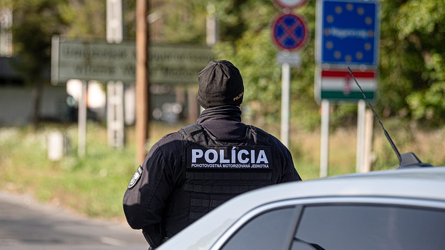 A Slovak police officer stands at the Hungarian-Slovakian border crossing point between Somoskoujfalu, Hungary, and Satorska Bukovinka, southern Slovakia.