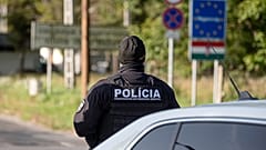 A Slovak police officer stands at the Hungarian-Slovakian border crossing point between Somoskoujfalu, Hungary, and Satorska Bukovinka, southern Slovakia.