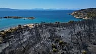 A view of a burned area a day after a wildfire in Peristeria village on the island of Salamina, 17 August, 2026