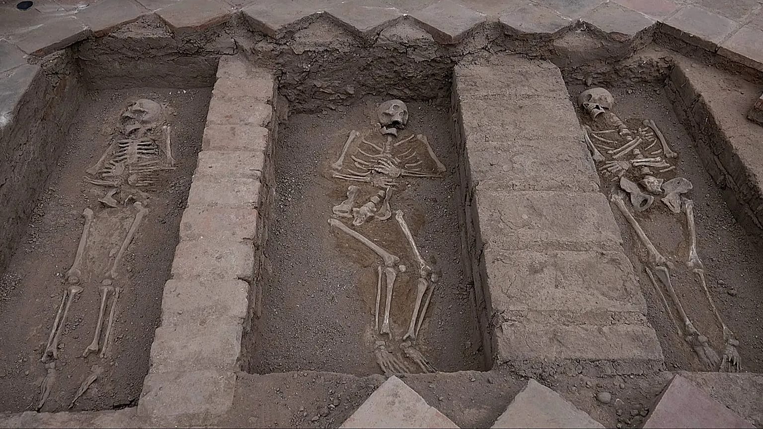 Skeletal remains inside the Espiritu Santo Hospital are exposed during excavation at the Sanctuary of Santa Rosa de Lima, in Lima, Peru, Tuesday, Aug. 25, 2026.
