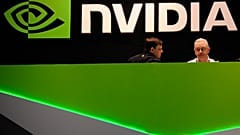 FILE. People gather in the Nvidia booth at the Mobile World Congress mobile phone trade show in Barcelona, Spain, Feb. 2014