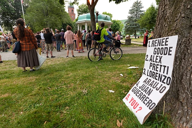 A sign at a vigil in Lewiston lists some of the people killed by federal agents, 14 July, 2026