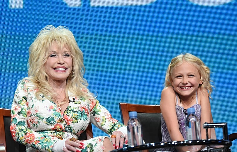 Dolly Parton and Alyvia Lind participate in the "Dolly Parton's Coat of Many Colors" panel at the The NBCUniversal Television Critics Association Summer Tour - 14 August 2015