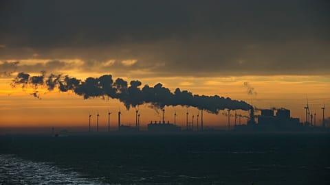 File - Wind turbines are seen as the sun rises over the northern Dutch port of Eemshaven, Netherlands, Monday 21 Jan., 2019. 