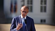 German Chancellor Friedrich Merz speaks before the start of the federal government's closed-door meeting at Neuhardenberg Castle, Germany, Tuesday, August 25, 2026.