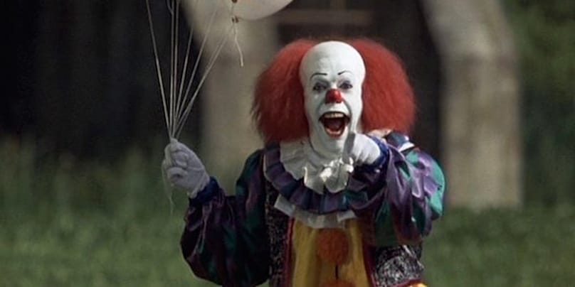Tim Curry en Pennywise dans It