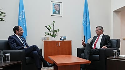 Cyprus' President Nikos Christodoulides and Turkish Cypriot leader Tufan Erhürman talk during their meeting at a UN compound in the Nicosia airport area, 26 August, 2026