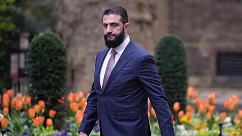 FILE. President of Syria Ahmed al-Sharaa walks towards 10 Downing Street to meet Britain's Prime Minister Keir Starmer in London, 31 March 2026