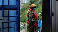 A health worker walks at a temporary health clinic at the Mpondwe border crossing linking Uganda and the Democratic Republic of the Congo, Thursday, 4 June, 2026.